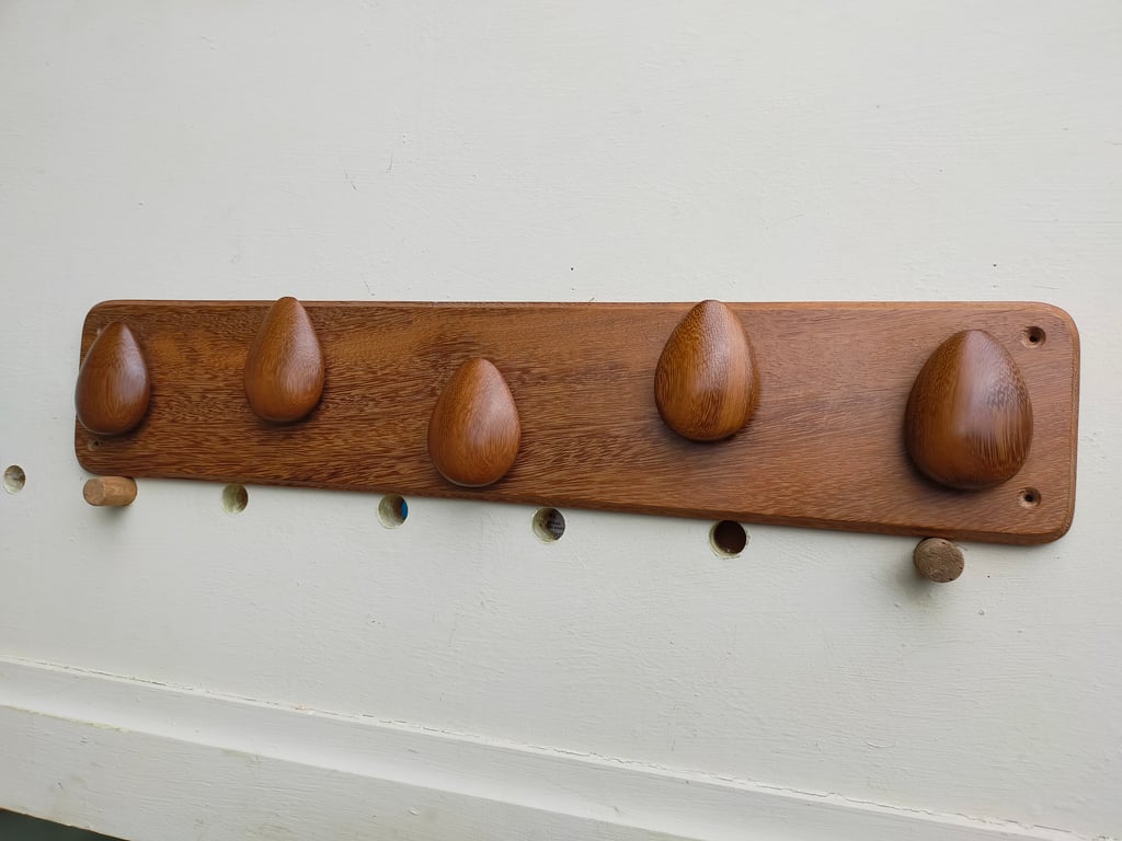 Five sapele pebbles