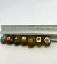 Handmade brown, ivory and turquoise patterned lamp work glass beads - Image 2