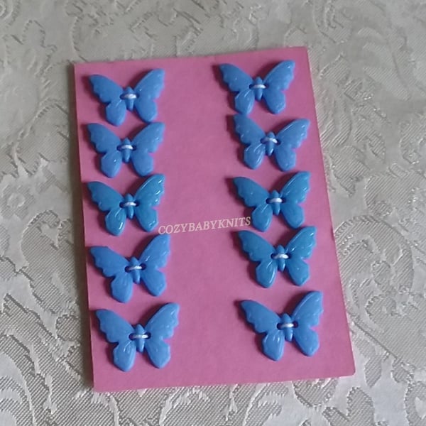 BLUE PLASTIC BUTTERFLY BUTTONS WITH TWO HOLES FOR ATTACHING 