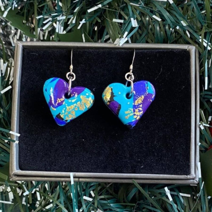 Purple and turquoise heart polymer clay earrings on sterling silver ear wires.