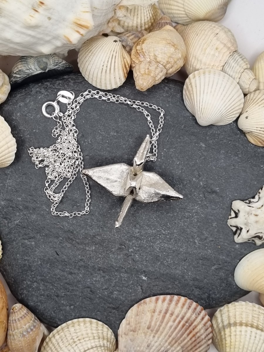 Real paper origami crane coated in silver pendant necklace