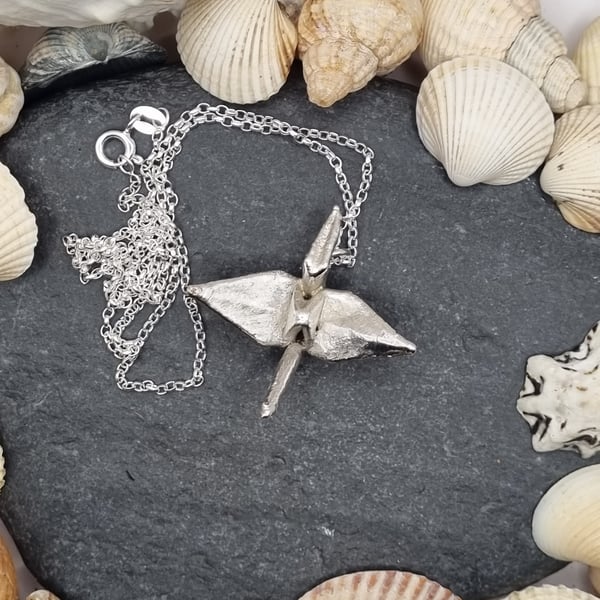 Real paper origami crane coated in silver pendant necklace