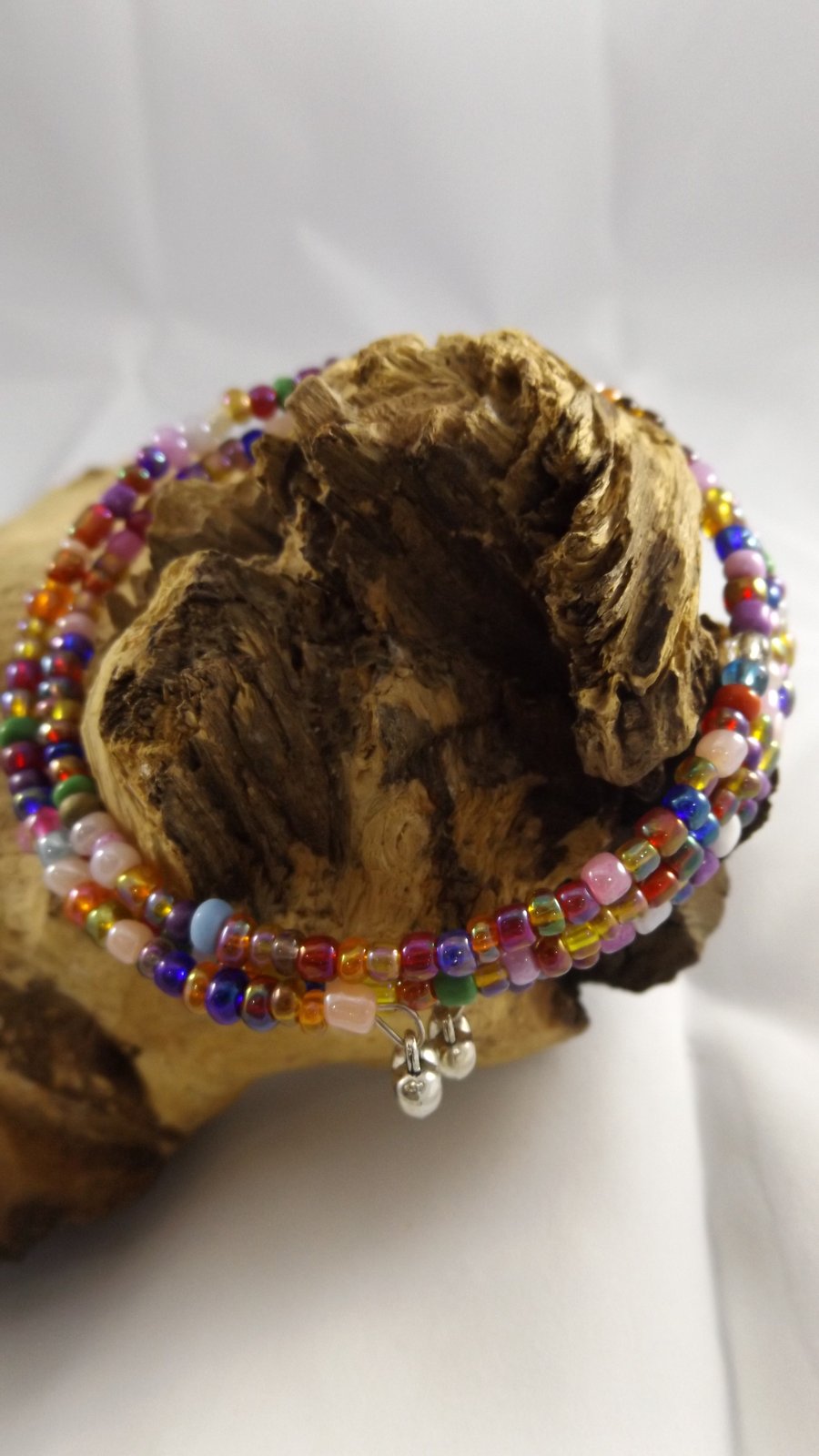 Multi coloured czech glass seed beaded bracelet with puffed silver plated hearts