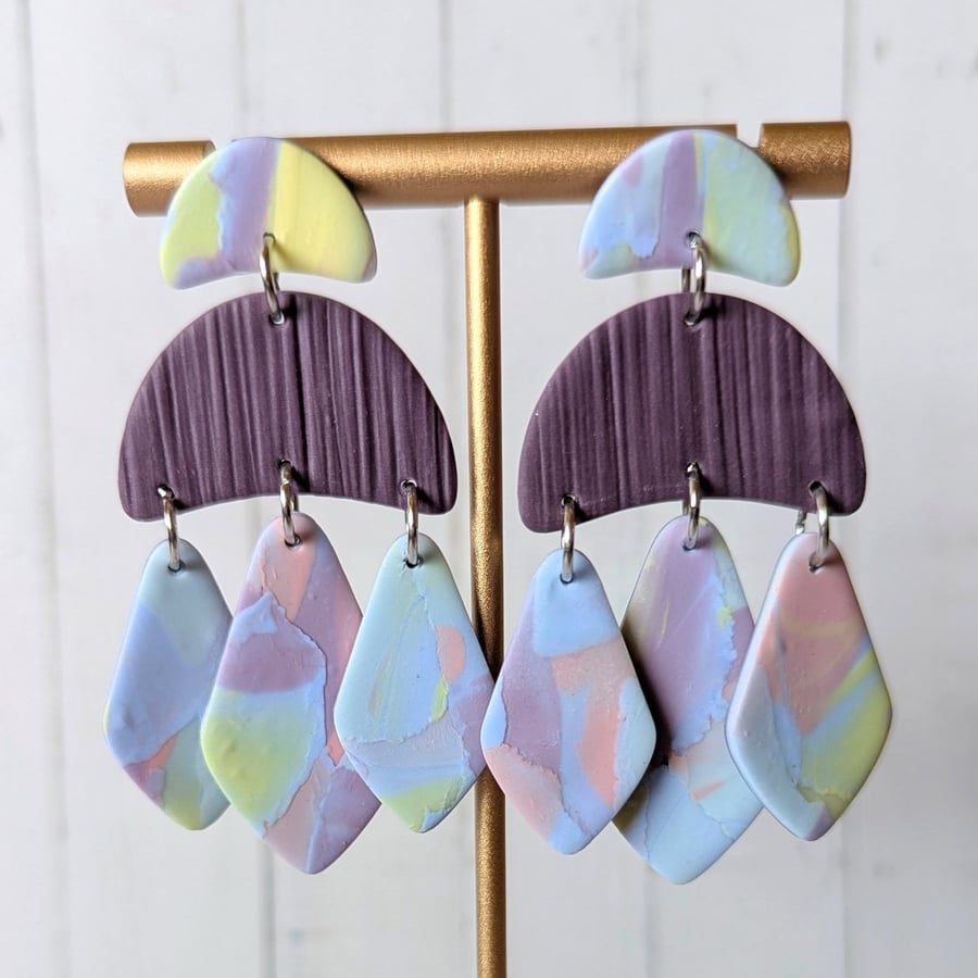 Triple diamond shape dangle earrings.