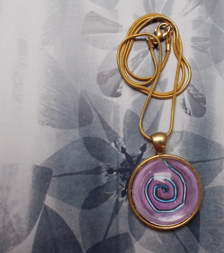 A Spiral within a Cabochon Pendant