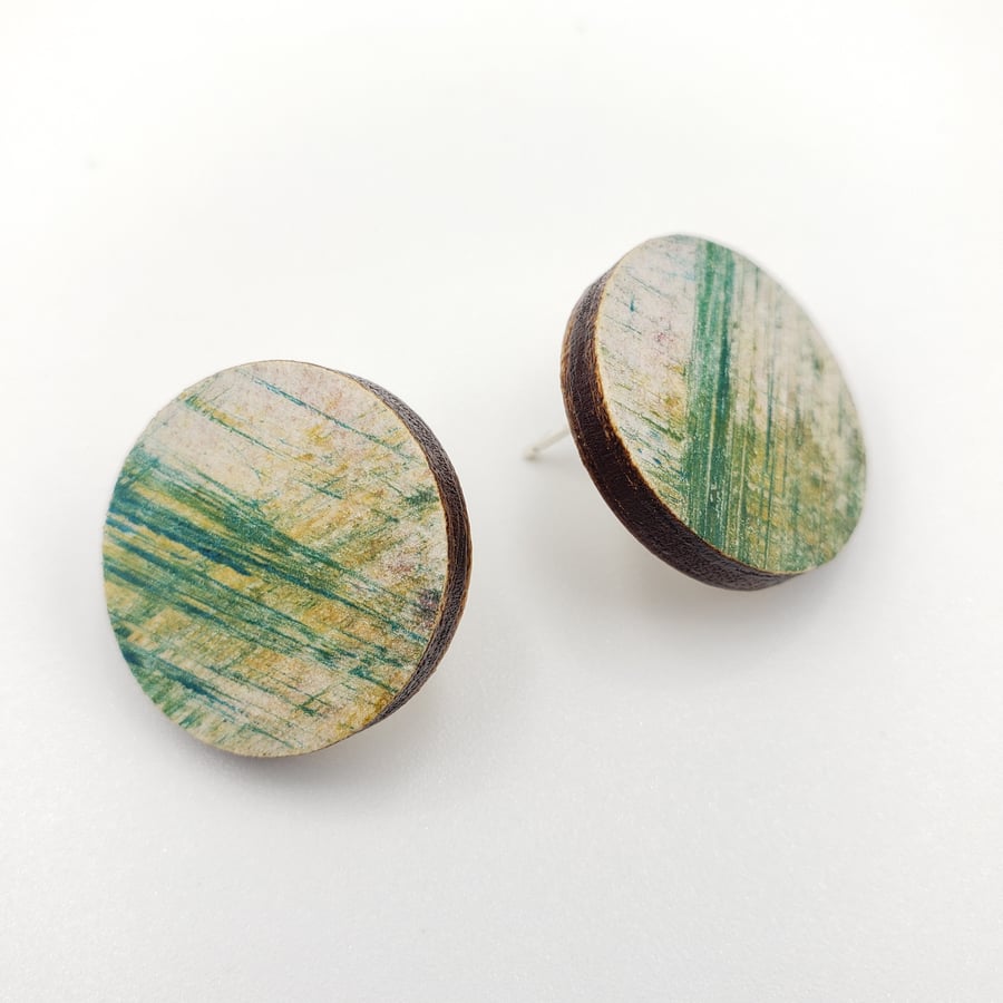 Circular wooden stud earrings in an abstract scribble print design
