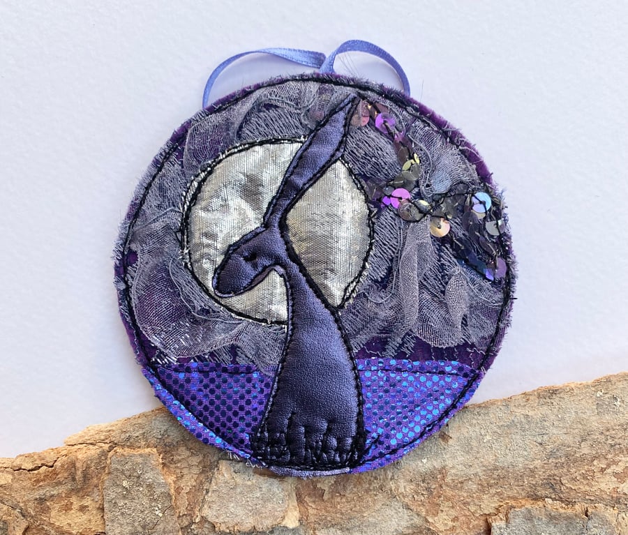 Upcycled embroidered moonlight hare home decoration. 
