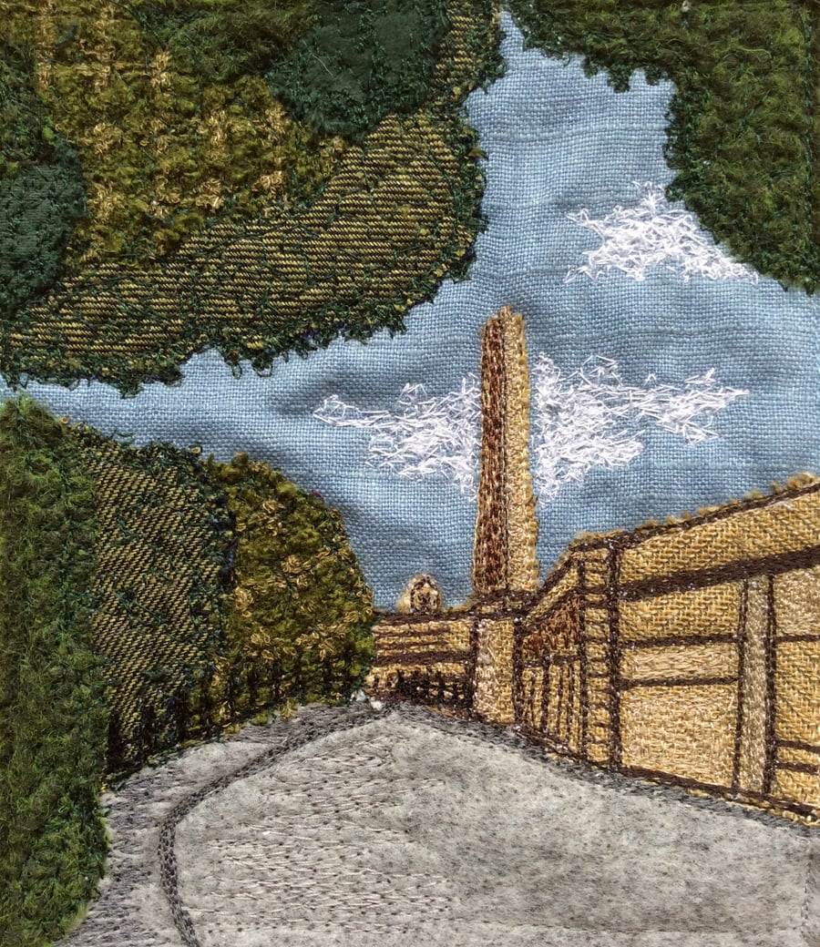 Up cycled fabric free motion embroiderey landscape. 