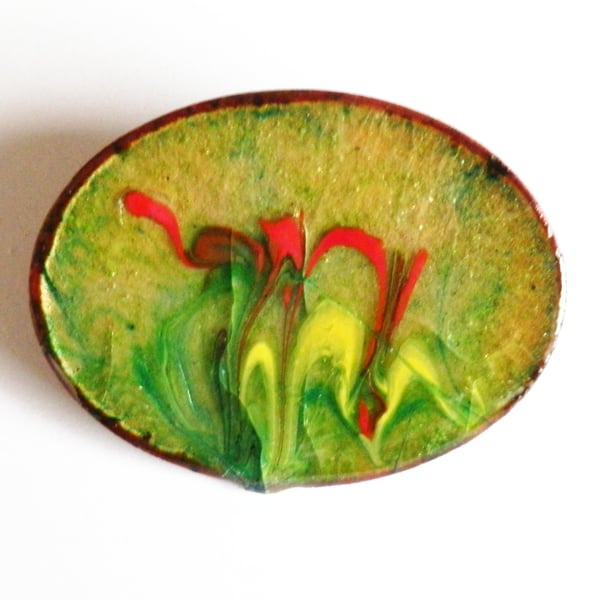 red and yellow enamel scrolled on light green over clear enamel - oval brooch