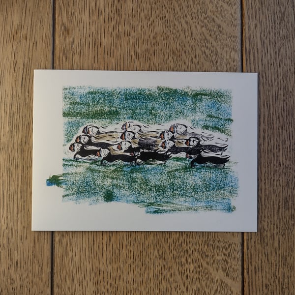 A raft of puffins, original design made using hand-cut stamps
