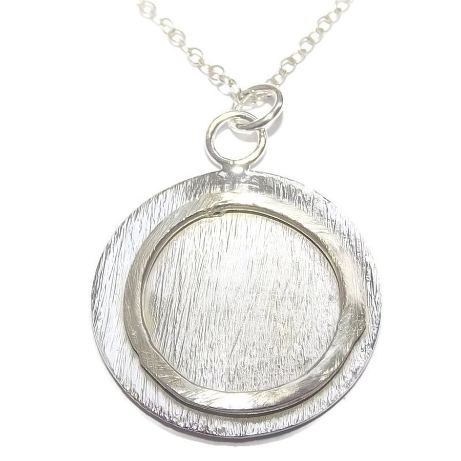 Handmade fine silver disc pendant