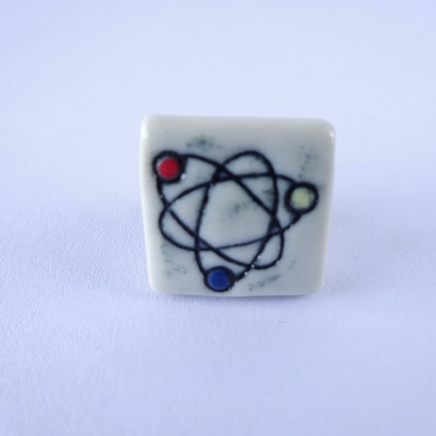 Ceramic atomic symbol pin badge, lapel pin