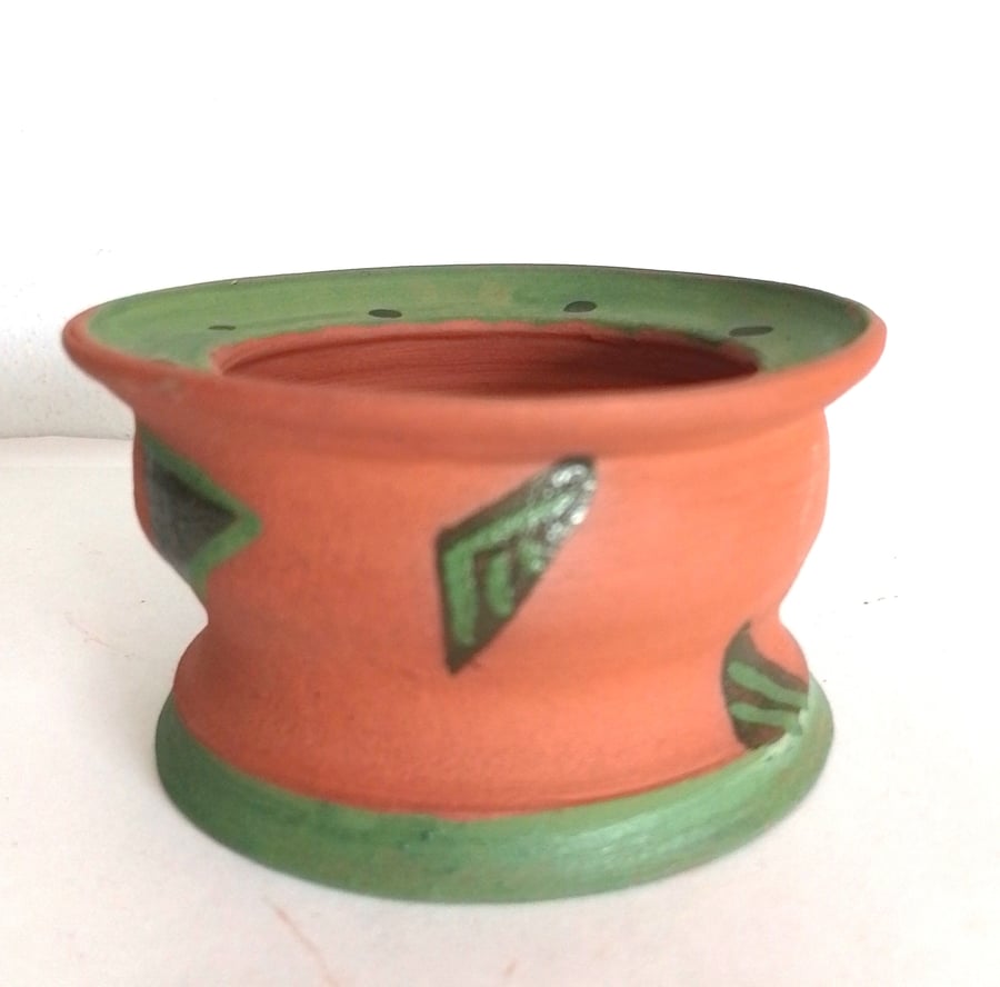 Pottery terracotta red church or pillar candleholder hand painted green motifs