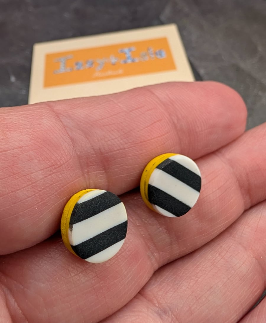 monochrome striped earrings with a yellow slither