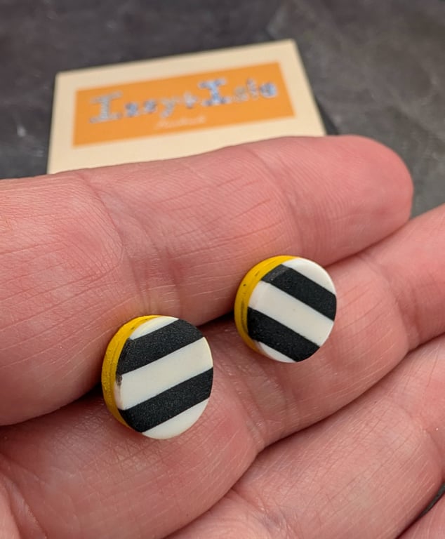 monochrome striped earrings with a yellow slither