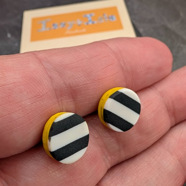 monochrome striped earrings with a yellow slither