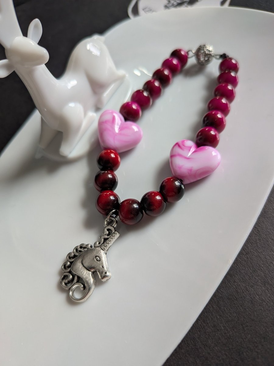 Pink and red heart beaded bracelet with unicorn 