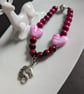 Pink and red heart beaded bracelet with unicorn 