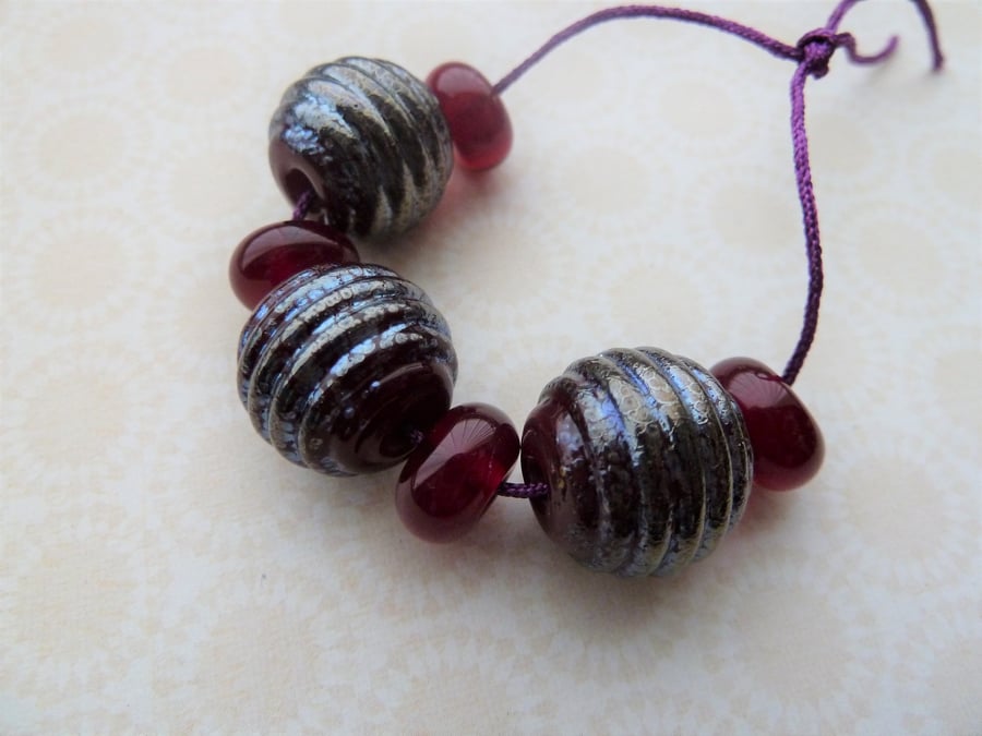 red and silver lampwork glass beads 