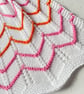 Orange, pink, and white striped baby blanket in cotton mix yarn  - Image 2