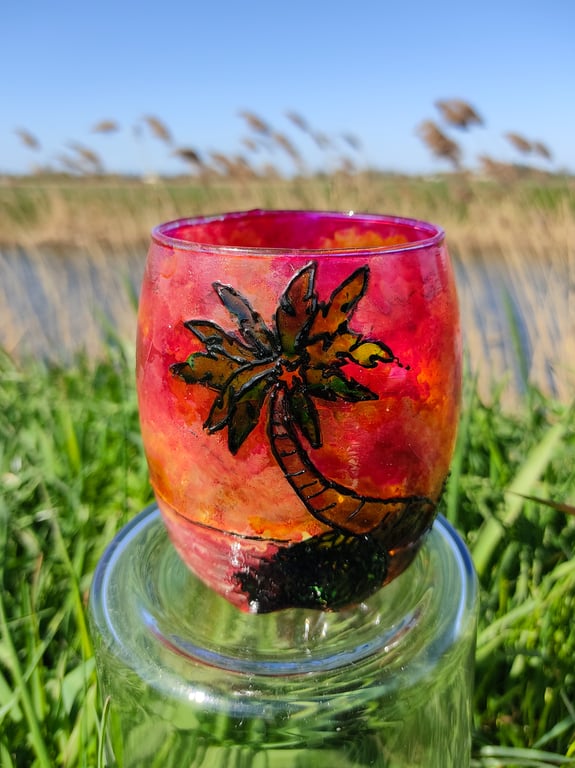Painted glass candle holder for tea light with sunset over palm tree island