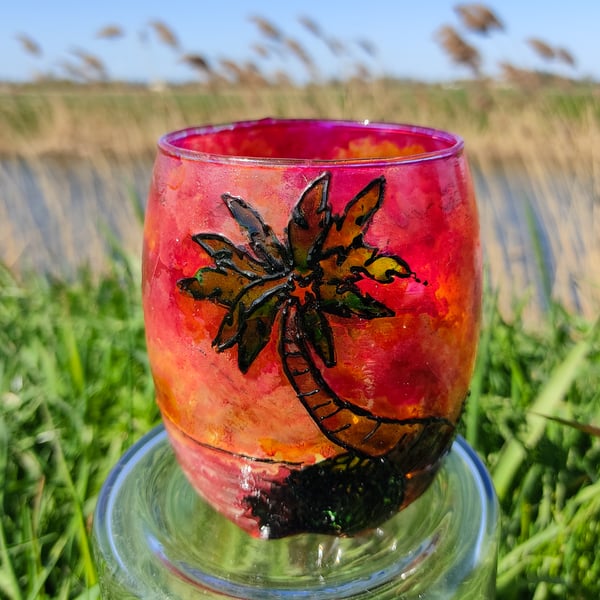 Painted glass candle holder for tea light with sunset over palm tree island