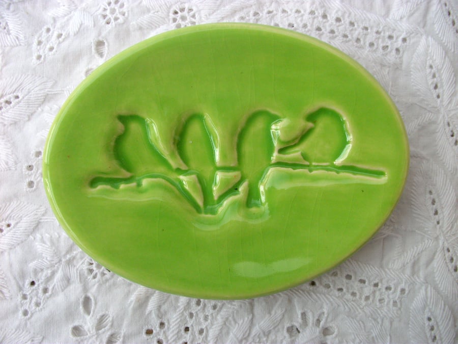 Ceramic little trinket dish imprined with a bird design 