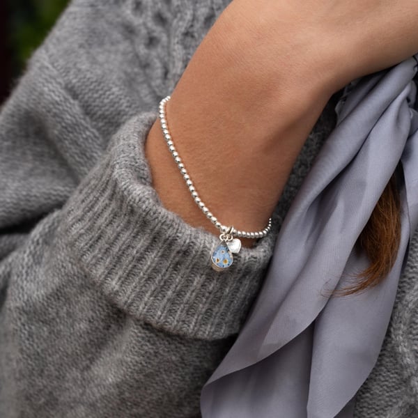 Sterling Silver Stretch Beaded Bracelet with a Real Flower Charm