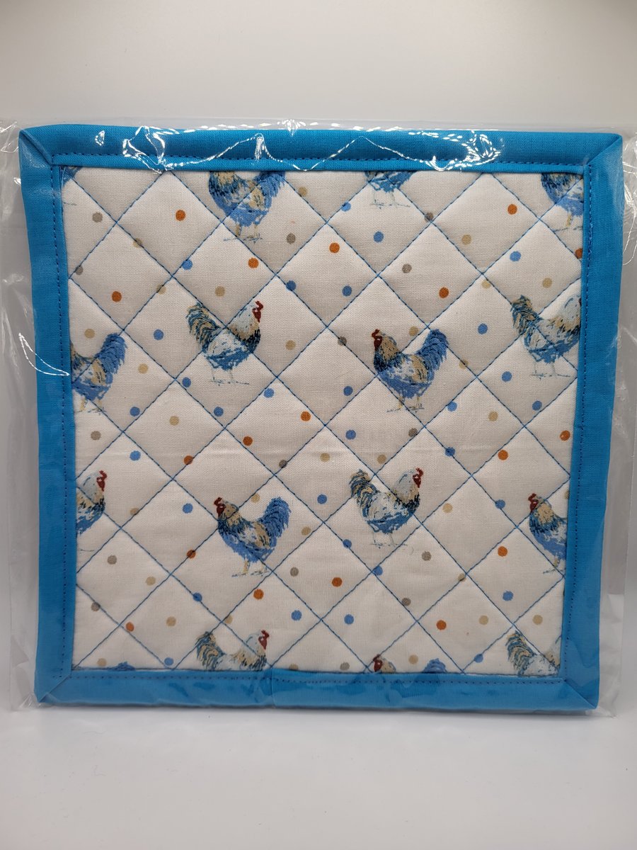 Handmade, quilted heat resistant pot holder