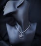 Silver pendant with round rutilated quartz - Image 1