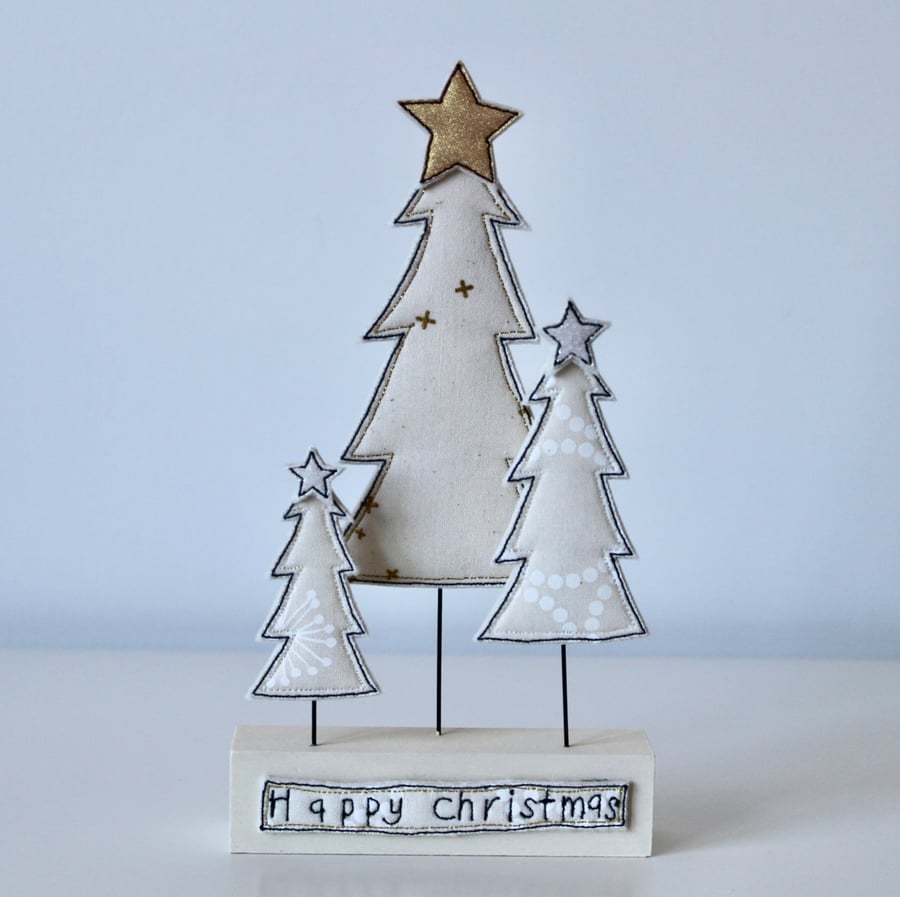 Three Christmas Trees on a Painted Wooden Block Stand