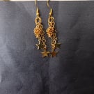 Gold pine cone and star charm dangle cascade earrings 