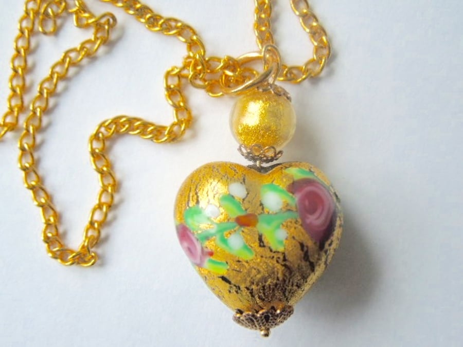 Gold Murano glass handmade heart pendant with gold chain.