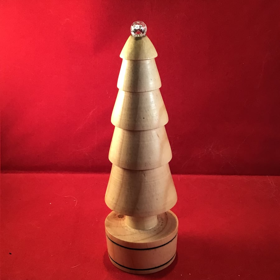 Crystal topped wooden christmas tree.
