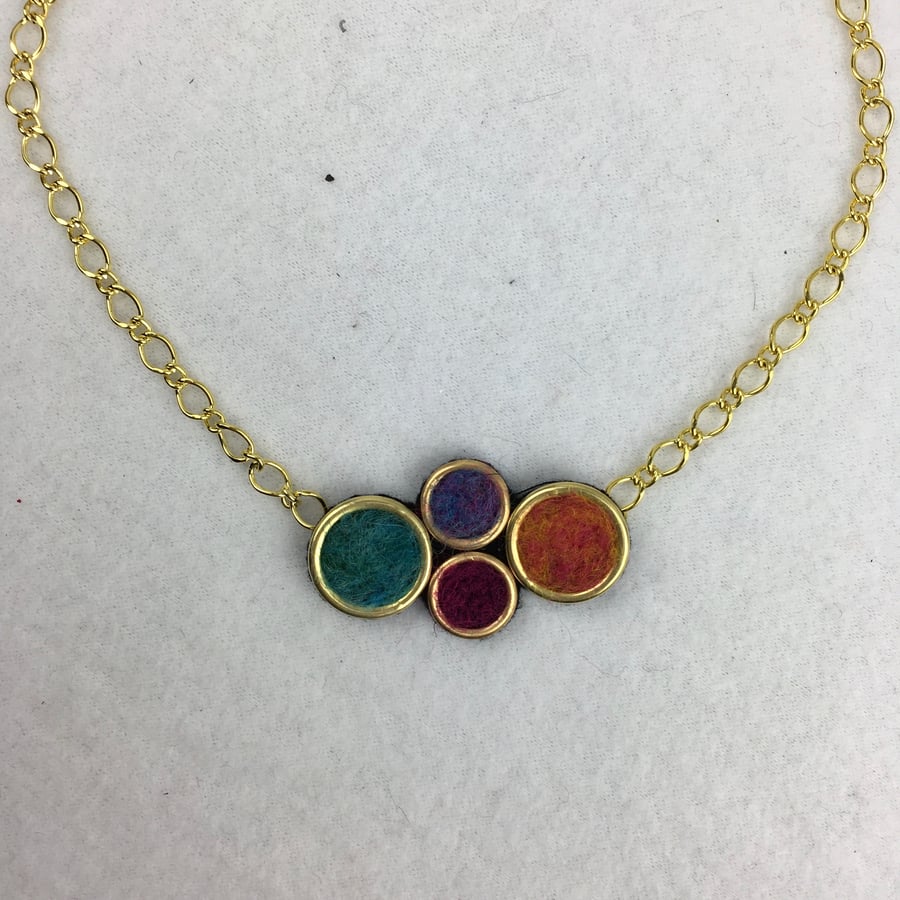 Bright multicoloured circular design needle felted necklace.
