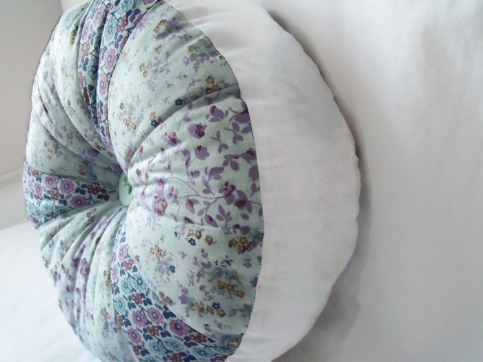 large plump pinwheel round scatter cushion mint and navy 13