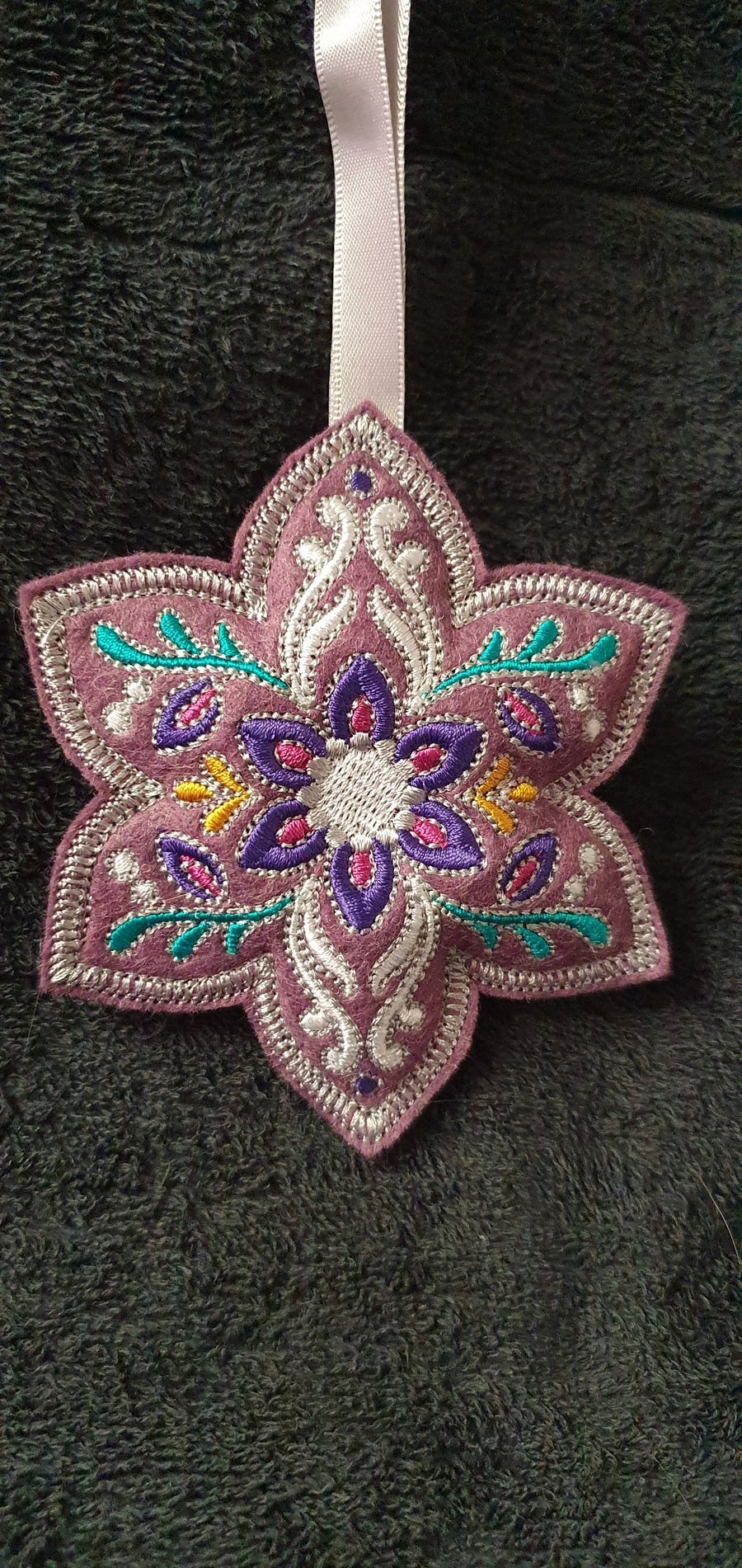 Embroidered felt decorations. Purple.