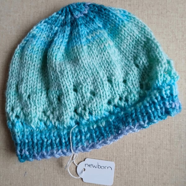 Hand-knitted beanie hat for newborn baby.  Price includes P and P. 