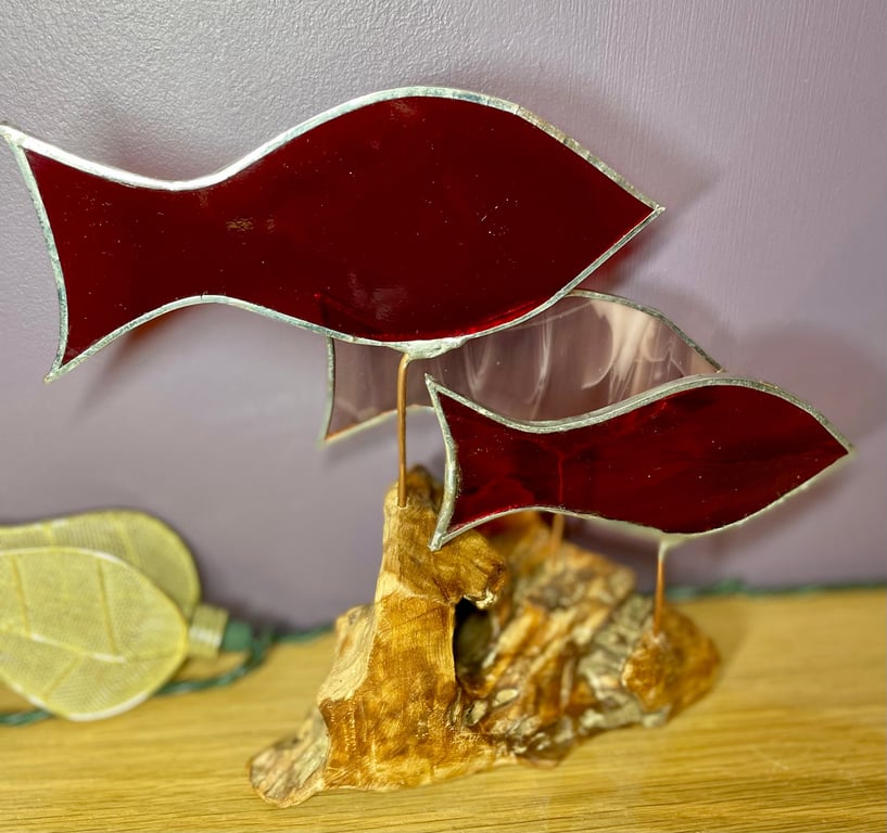 Stained glass fish (red and pink) on drift wood sculpture