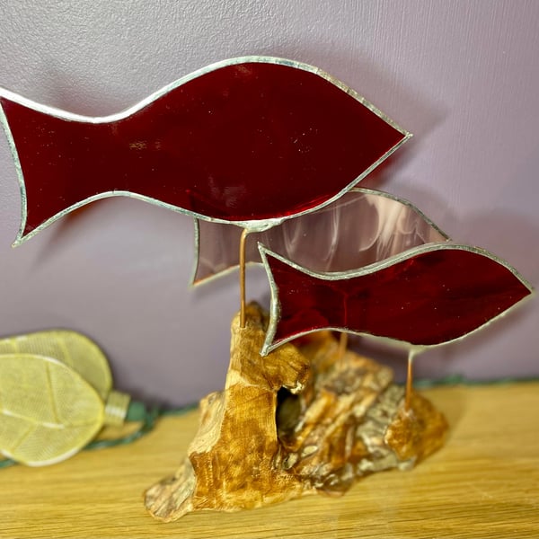 Stained glass fish (red and pink) on drift wood sculpture