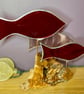 Stained glass fish (red and pink) on drift wood sculpture