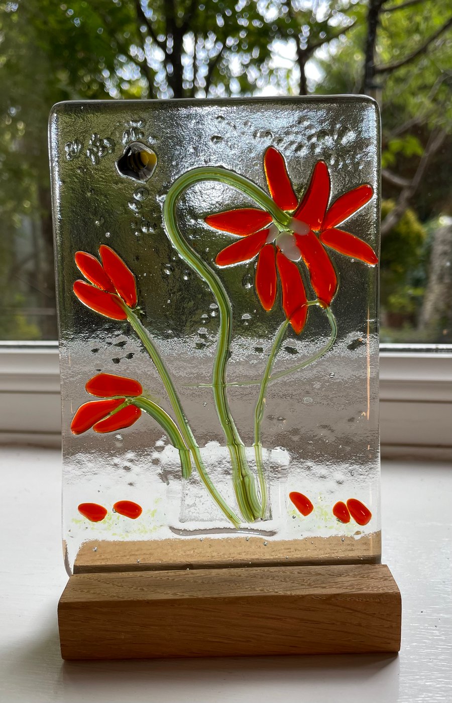 Fused glass vases of flowers
