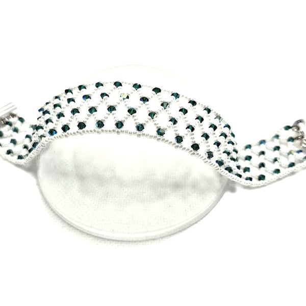 White seed bead netted cuff style bracelet with green Swarovski crystals