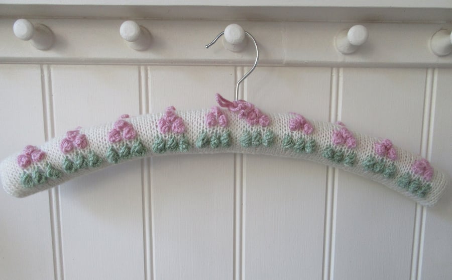Clothes hanger coat hanger with sorbet pink bobble bud flowers