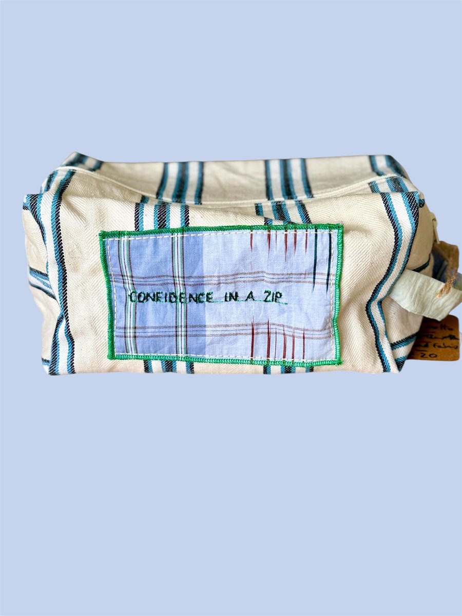 Upcycled travel-toiletry pouch , "Confidence in a Zip"