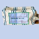 Upcycled travel-toiletry pouch , "Confidence in a Zip"