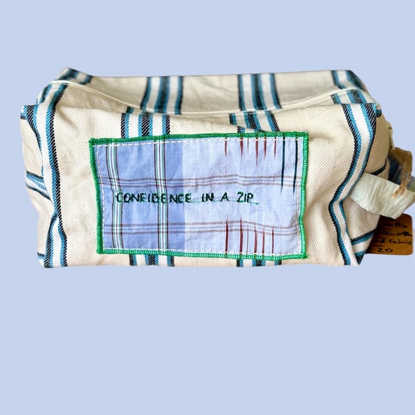 Upcycled travel-toiletry pouch , "Confidence in a Zip"