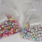 Small bracelet making kit including alphabet beads and many decorative beads