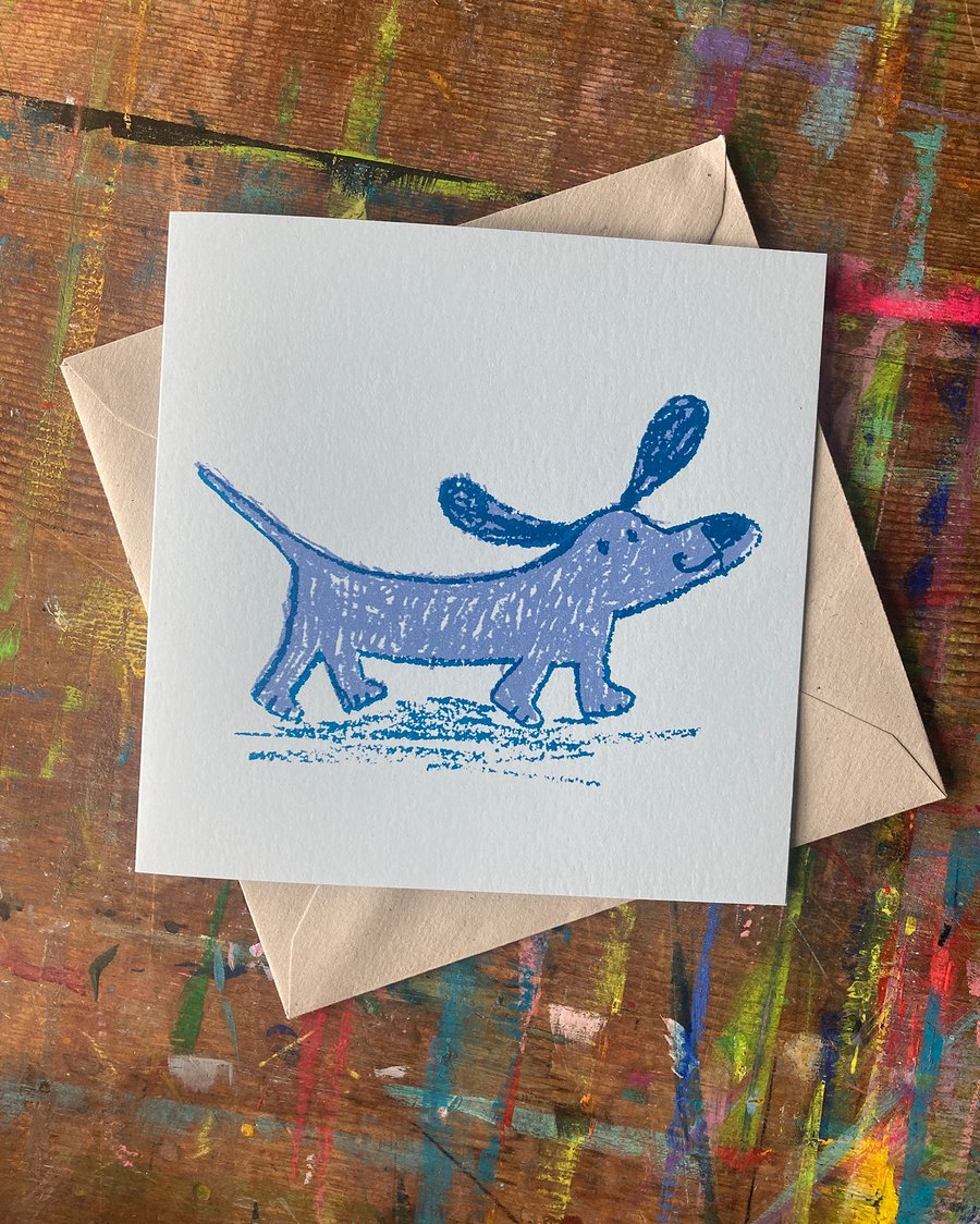 Happy sausage dog square card-pale blue by Jo Brown