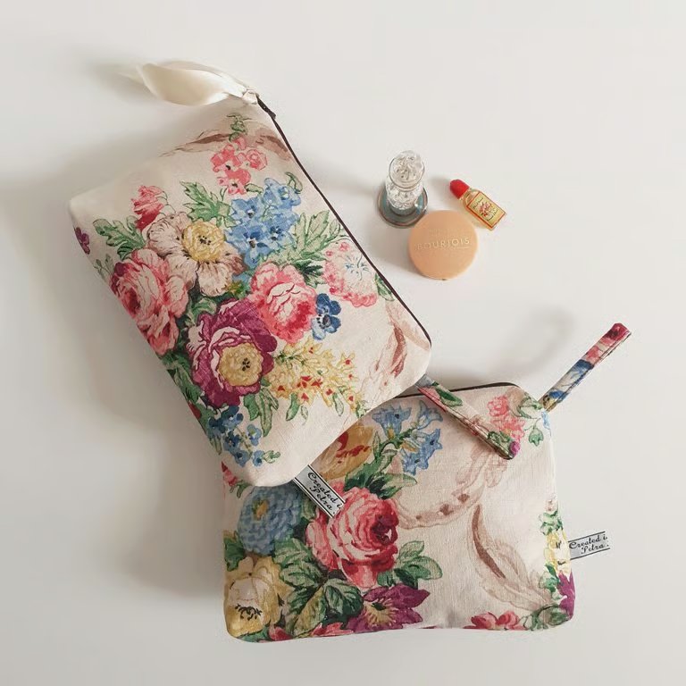 Make up cosmetics or toiletries bag upcycled in a vintage roses print fabric